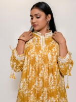 mustard floral print flared A-line stand collar kurta enhanced with lace on the collar and roll-on dori 3/4 sleeves