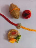 Traditional kundan booti rakhi with mini coconut roli and chawal