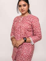 onion pink bandhani print top length loose fit short kurti with pleated shoulder yolk enhanced with lace