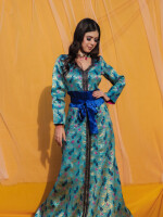 Peacock Blue Brocade Dress,Made with the rich brocade material with American crepe lining and raw silk belt with attached tassel