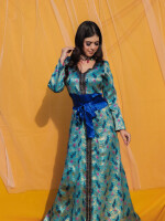 Peacock Blue Brocade Dress,Made with the rich brocade material with American crepe lining and raw silk belt with attached tassel