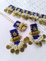 Regal blue kundan necklace, tika, and earrings set with silver and golden beads