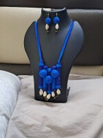 Exclusive handmade blue thread necklace with earrings.