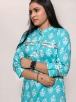 turquoise blue apple cut stand collar printed co-ord set with roll-on sleeves highlighted with matte gold buttons and coin-enhanced pockets