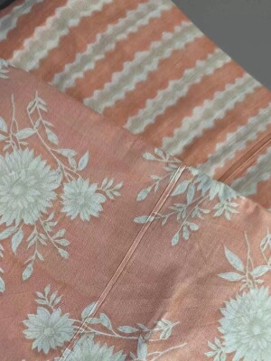 Peach cotton dress material featuring floral and striped pattern