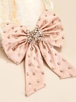 Bow Bliss Hair Clip ,  An exquisite hair clip adorned with intricate stonework