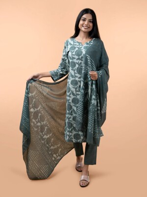 Green hand block printed cotton suit three piece set includes a kurta with pants and dupatta.