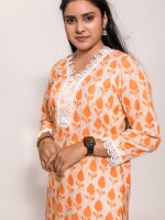 Straight-cut stylish orange and yellow motif floral kurta with a beautiful lace neckline and 3/4 sleeves