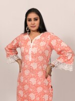 Straight-cut soft orange and white printed kurta highlighted with lace and pearls, paired with Leheriya cotton pants.