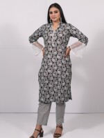 The straight-cut cotton black and white printed kurta with organza bell sleeves, crosia lace, and matching buttons, paired with Leheriya cotton pants