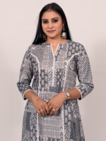 A-line cotton grey printed kurti highlighted with a lace on princess line lace, paired with Leheriya cotton pants