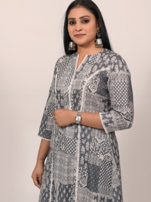 A-line cotton grey printed kurti highlighted with a lace on princess line lace, paired with Leheriya cotton pants