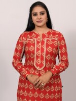 Straight-cut red cotton printed kurta with an elegant flowing lace pattern on the sleeve and yoke line, paired with matching printed cotton pants
