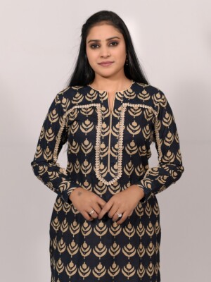 straight-cut blue cotton printed kurta with an elegant lace pattern on the sleeves and yoke line, paired with matching solid blue or beige cotton pant