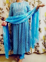 The Aqua Blue Nyra Cut Kurta Set,accompanied by a chiffon dupatta, featuring heavy detailing at the yoke and slits