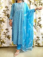 The Aqua Blue Nyra Cut Kurta Set,accompanied by a chiffon dupatta, featuring heavy detailing at the yoke and slits