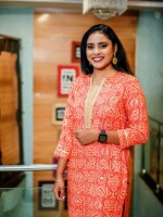 Straight Cut Soft Rayon Reddish Orange Sun Printed Kurti, blends comfort with style, making it suitable for any occasion, festivals, and puja at home.