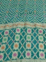 TURQUOISE Khadi Chiffon Bandhej Mina, a celebration of traditional craftsmanship and contemporary elegance.