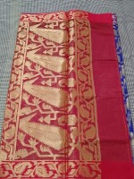 RED Zari Brocade Silk Saree, a timeless piece that seamlessly blends traditional craftsmanship with contemporary elegance