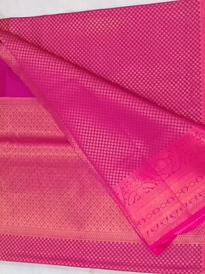 A Zari Brocade silk saree is a traditional Indian saree, rich and intricate weave, featuring zari work.