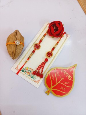 Red and golden bhai bhabhi rakhi set with mini nariyal roli and chawal