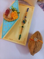 Peacock feather beaded single rakhi for bhai with nariyal roli and chawal