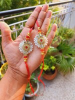 Elegant white and red rakhi for brother