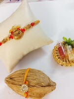 Metal kalash rakhi for bhai with nariyal roli and chawal symbol of blessings