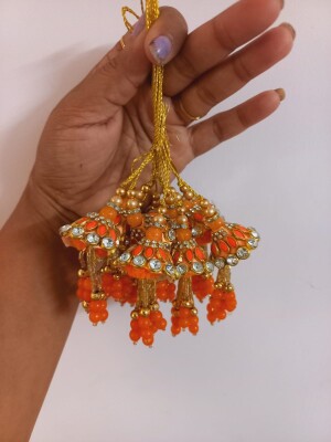 Orange lumba rakhi for Bhabhi symbol of love and elegance