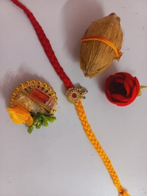 Traditional kundan booti rakhi with mini coconut roli and chawal