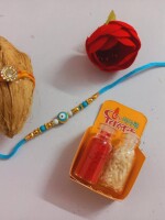 Blue evil eye rakhi for bhai with mini nariyal roli and chawal