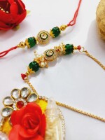 Beautiful crafted green stone rakhi set for bhai and bhabhi