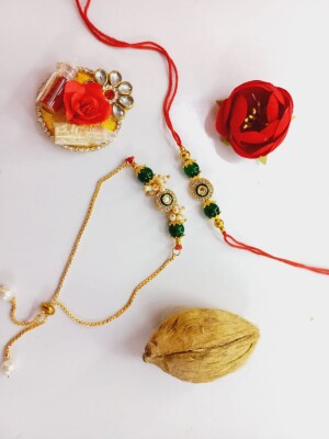 Beautiful crafted green stone rakhi set for bhai and bhabhi